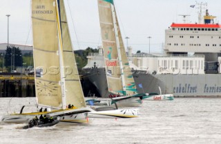 ORMA 60 trimarans on the River Thames leaving London in the Multicup SAS