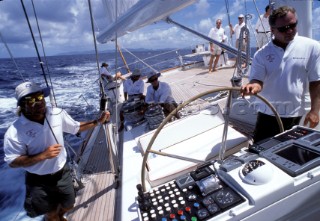 Racing onboard a superyacht with skipper driving boat and navigator navigating