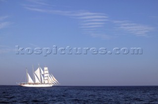 Graphic sails and shapes of the masts and sails of a cruising superyacht cruise ship