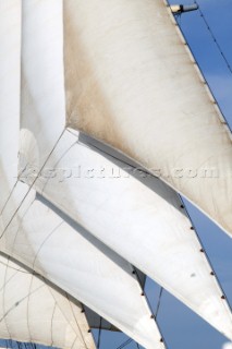 Graphic sails and shapes of the masts and sails of a cruising superyacht cruise ship