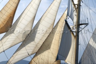 Graphic sails and shapes of the masts and sails of a cruising superyacht cruise ship