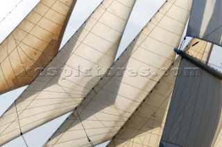 Graphic sails and shapes of the masts and sails of a cruising superyacht cruise ship