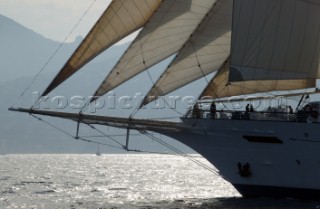 Graphic sails and shapes of the masts and sails of a cruising superyacht cruise ship