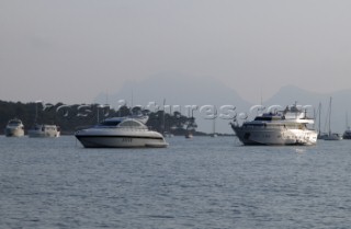 Mangusta powerboat superyacht at anchor in a tranquille bay