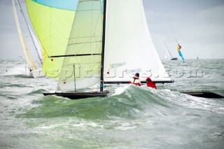 COWES, ENGLAND - AUGUST 1: A breaking wave soaks the crew of a Dragon one design boat during day 4 of Skandia Life Cowes Week 2006. (Photo by Kos/Kos Picture Source via Getty Images)