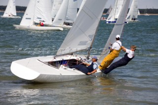 COWES, ENGLAND - JULY 29: The crew of the International Etchells Class yacht Freelance lean out on the shrouds and rigging to try and recover the yacht from rocks on the Cowes shoreline (Photo by Kos/Kos Picture Source via Getty Images)