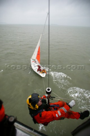 Coastguard being winched from Helicopter to Yacht in Distress for Rescue operation