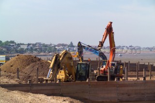 Sea defence building in whitstable kent raising the level of the beach some meters to counter rising sea level and erosion