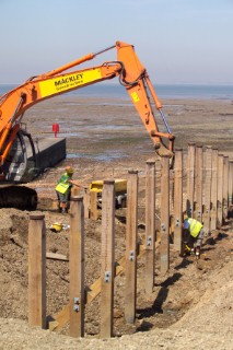 Sea defence building in whitstable kent raising the level of the beach some meters to counter rising sea level and erosion new breakwater being built