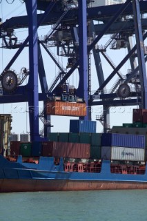 The unloading of a commercial container vessel