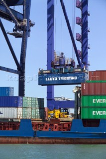 The unloading of a commercial container vessel