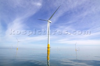 Windmills in a wind farm in sea estuary