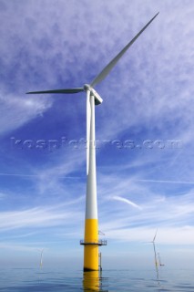 Windmills in a wind farm in sea estuary