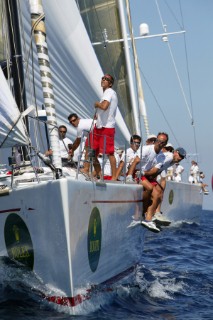 PORTO CERVO, SARDINIA - SEPT 6th 2006: The crew of Aleph (ITA) owned by Giorgio Ruffe hike out to windward to balance the yacht as the sail trimmer draws the maximum drive from the asymmetric spinnaker whilst racing at the Maxi Yacht Rolex Cup 2006 in Porto Cervo, Sardinia. The Maxi Rolex Cup attracts the most glamorous sailing and racing yachts in the world, including a fleet of contemporary Wally yachts, the most modern and technologically advanced maxi yachts afloat. (Photo by Tim Wright/Kos Picture Source via Getty Images)