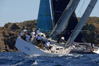 PORTO CERVO, SARDINIA - SEPT 6th 2006: The 20 metre yacht OPS 5 (ITA) owned by Massimo Violati tacking amongst the maxi fleet in the Madellena Islands at the Maxi Yacht Rolex Cup 2006 in Porto Cervo, Sardinia. The Maxi Rolex Cup attracts the most glamorous sailing and racing yachts in the world, including a fleet of contemporary Wally yachts, the most modern and technologically advanced maxi yachts afloat. (Photo by Tim Wright/Kos Picture Source via Getty Images)