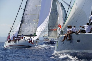 PORTO CERVO, SARDINIA - SEPT 6th 2006: The 18 metre racing yacht Aleph (ITA) owned by Giorgio Ruffe reaches under spinnaker to windward past Edimetra (ITA) owned by Ernesto Gismondi and Charis (ITA) at the Maxi Yacht Rolex Cup 2006 in Porto Cervo, Sardinia. The Maxi Rolex Cup attracts the most glamorous sailing and racing yachts in the world, including a fleet of contemporary Wally yachts, the most modern and technologically advanced maxi yachts afloat. (Photo by Tim Wright/Kos Picture Source via Getty Images)