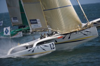 PORT de FECAMP, FRANCE - SEPT 9th 2006: The Open 60 trimaran GITANA 12 (Fra) skippered by Thierry Duprey de Vorsent racing in the Grand Prix de Fecamp on September 9th 2006. GITANA 12 finished 4th overall. The Grand Prix de Port de Fecamp is part of the Multi Cup 60 Cafe Ambassador. (Photo by Gilles Martin-Raget/Kos Picture Source via Getty Images)