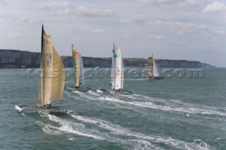 PORT de FECAMP, FRANCE - SEPT 9th 2006: The Open 60 trimaran fleet racing in the Grand Prix de Fecamp on September 9th 2006. GROUPAMA-2 (Fra) skippered by Franck Cammas won the event. The Grand Prix de Port de Fecamp is part of the Multi Cup 60 Cafe Ambassador. (Photo by Gilles Martin-Raget/Kos Picture Source via Getty Images)