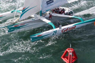 PORT de FECAMP, FRANCE - SEPT 9th 2006: The crew prepare the sails on the Open 60 trimaran GEANT (Fra) skippered by Michel Desjoyeaux in the Grand Prix de Fecamp on September 9th 2006. GEANT finished the event in third. The Grand Prix de Port de Fecamp is part of the Multi Cup 60 Cafe Ambassador. (Photo by Gilles Martin-Raget/Kos Picture Source via Getty Images)