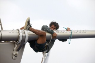 PORTO CERVO, SARDINIA - SEPT 9th 2006: The bowman of the Wally yacht Dangerous but Fun hangs from the bowsprit following tripping the spinnaker from the end during racing in the Maxi Yacht Rolex Cup on September 9th 2006. Dangerous but Fun finished 6th overall. The Maxi Yacht Rolex Cup is the largest maxi regatta in the world, which attracts the worlds fastest and most expensive sailing yachts to Porto Cervo, Sardinia bi-annually. (Photo by Tim Wright/Kos Picture Source via Getty Images)