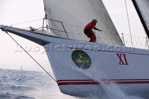 PORTO CERVO SARDINIA  SEPT 9th 2006 The bowman onboard the canting keel maxi Wild Oats hangs on as t