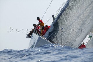 PORTO CERVO, SARDINIA - SEPT 9th 2006: Flying Dragon (ITA) the maxi yacht of Paolo Scerni sets the spinnaker pole on the approach to the windward mark during racing in the Maxi Yacht Rolex Cup on September 9th 2006. Flying Dragon finished 6th overall in the Mini Maxi Division. The Maxi Yacht Rolex Cup is the largest maxi regatta in the world, which attracts the fastest and most expensive sailing yachts to Porto Cervo, Sardinia bi-annually. (Photo by Tim Wright/Kos Picture Source via Getty Images)