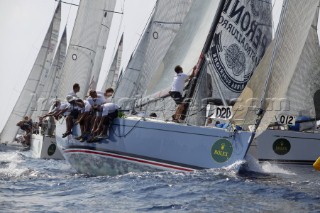 PORTO CERVO, SARDINIA - SEPT 12th 2006: The Swan 45 Fever (GBR) owned by Klaus Diederichs rounds the windward mark during Race 1 of the Rolex Swan Cup on September 12th 2006. She includes British Americas Cup sailor Mel Coleman (3rd from right) in her crew. Fever finishes 6th. The Rolex Swan Cup, started in 1982, is the principle event on the Swan racing circuit. Nautors Swan yachts, celebrating its 40th year in production, build the best series production yachts afloat. (Photo by Tim Wright/Kos Picture Source via Getty Images)