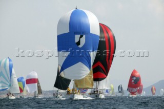 PORTO CERVO, SARDINIA - SEPT 13th 2006:  The Swan 57 Yellowdrama (GBR) owned by Stephen Matthews leads a fleet of Swans on a spinnaker run during Day 2 of the Rolex Swan Cup on September 13th 2006. The Rolex Swan Cup, started in 1982, is the principle event on the Swan racing circuit. Nautors Swan yachts, celebrating its 40th year in production, build the best series production yachts afloat. (Photo by Tim Wright/Kos Picture Source via Getty Images)