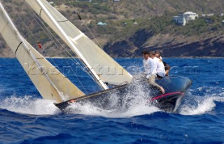 Crew on the rail of a boat dring a port tack in the Antigua Classic Yacht Regatta April 2006