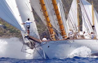 Antigua Classic Yacht Regatta April 2006. One of sequence of five pictures of bowman standing at end of bowsprit directing operations on a large boat