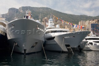 Line up of bows of superyachts and motoryachts moored in harbour at the Monaco Yacht Show