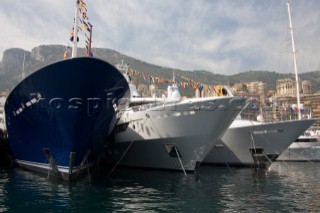 Line up of bows of superyachts and motoryachts moored in harbour at the Monaco Yacht Show