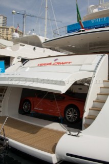 Red sports car in the stern garage of a superyacht