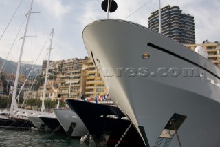 Line up of bows of superyachts and motoryachts moored in harbour at the Monaco Yacht Show