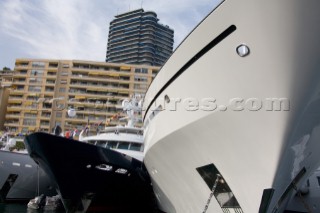 Line up of bows of superyachts and motoryachts moored in harbour at the Monaco Yacht Show