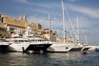 Line up of bows of superyachts and motoryachts moored in harbour at the Monaco Yacht Show