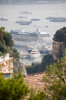 Mega yachts and superyachts moored in Monaco harbour, where cruise ships now also have berths