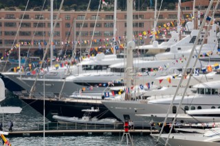 Mega yachts and superyachts moored in Monaco harbour, where cruise ships now also have berths