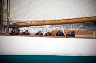 SAINT-TROPEZ, FRANCE - The wet and tired crew on the deck of the classic gaff rigged yacht Mariquita built in 1911, during racing in the Voiles de St Tropez on October 3rd 2006. The largest classic and modern yachts from around the world gather in Saint-Tropez annually for a week of racing and festivities to mark the end of the Mediterranean season, before heading across the Atlantic to winter in the Caribbean.