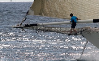 PALMA, MAJORCA - October 12th 2006: The brave bowman on the 46 metre sailing superyacht Windrose of Amsterdam from Holland, owned by Chris Condriep and designed by famous naval architect Gerard Dijkstra, climbs out along the bowsprit as the sharp metal dolphin cutter below slices through the water, during Race 1 of The Superyacht Cup on October 12th 2006. The Nautor Swan yacht Virago won the race. (Photo by Kos/Kos Picture Source)