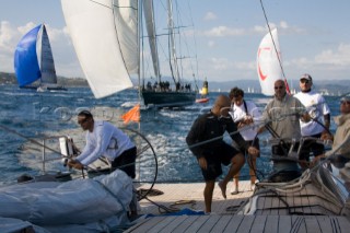 SAINT-TROPEZ, FRANCE - October 5th: The crew onboard the Wally maxi yacht Dangerous But Fun of Monaco owned by Michelle Perris trim the spinnaker to keep ahead of Nariida (Norway) on October 5th 2006. The largest classic and modern yachts from around the world gather in Saint-Tropez annually for a week of racing and festivities to mark the end of the Mediterranean season, before heading across the Atlantic to winter in the Caribbean.