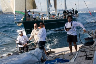 SAINT-TROPEZ, FRANCE - October 5th: The crew onboard the Wally maxi yacht Dangerous But Fun of Monaco owned by Michelle Perris trim the spinnaker to stay ahead of Nariida (Norway) on October 5th 2006. Dangerous But Fun crossed the finish in 2nd place. The largest classic and modern yachts from around the world gather in Saint-Tropez annually for a week of racing and festivities to mark the end of the Mediterranean season, before heading across the Atlantic to winter in the Caribbean.