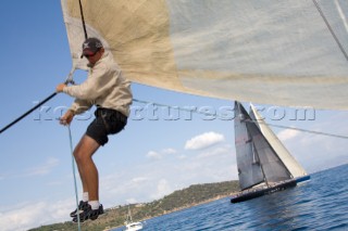 SAINT-TROPEZ, FRANCE - October 5th: The bowman adjusts the jib sheets onboard the Wally maxi yacht Dangerous But Fun of Monaco owned by Michelle Perris during racing on October 5th 2006. The largest classic and modern yachts from around the world gather in Saint-Tropez annually for a week of racing and festivities to mark the end of the Mediterranean season, before heading across the Atlantic to winter in the Caribbean.