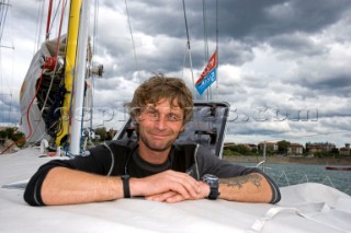 BILBAO, SPAIN - October 22nd 2006: Bernard Stamm (SUI), skipper of Open 60 Monohull  CHEMINƒES POUJOULAT appearing from a deck hatch on his yacht. The deck hatch can be used as an escape hatch in an emergency. The Velux 5 Oceans is a three part round the world yacht race for the bravest of solo sailors. Leg 1 is approximately 12,000 miles from Bilbao in Spain to Fremantle in Western Australia. It is the ultimate test of sailing skill, stamina and endurance. (Rights restrictions may apply)