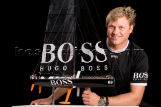 BILBAO, SPAIN - October 22nd 2006: Alex Thomson (GBR) skipper of Open 60 monohull HUGO BOSS with a model of his boat. The Velux 5 Oceans is a three part round the world yacht race for the bravest of solo sailors. Leg 1 is approximately 12,000 miles from Bilbao in Spain to Fremantle in Western Australia. It is the ultimate test of sailing skill, stamina and endurance. (Rights restrictions may apply)