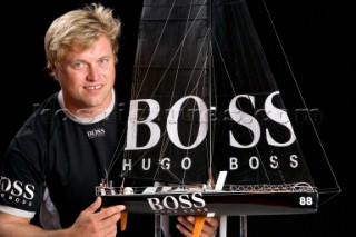 BILBAO, SPAIN - October 22nd 2006: Alex Thomson (GBR) skipper of Open 60 monohull HUGO BOSS with a model of his boat. The Velux 5 Oceans is a three part round the world yacht race for the bravest of solo sailors. Leg 1 is approximately 12,000 miles from Bilbao in Spain to Fremantle in Western Australia. It is the ultimate test of sailing skill, stamina and endurance. (Rights restrictions may apply)