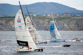 BILBAO, SPAIN - October 22nd 2006: Unai Basurko de Miguel (ESP), skipper of the Open 60 yacht  PAKEA leads SAGA INSURANCE at the start. The Velux 5 Oceans is a three part round the world yacht race for the bravest of solo sailors. Leg 1 is approximately 12,000 miles from Bilbao in Spain to Fremantle in Western Australia. It is the ultimate test of sailing skill, stamina and endurance. (Rights restrictions may apply)