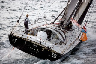 BILBAO, SPAIN - October 22nd 2006: Alex Thomson (GBR) onboard his Open 60ft monohull HUGO BOSS. The Velux 5 Oceans is a three part round the world yacht race for the bravest of solo sailors. Leg 1 is approximately 12,000 miles from Bilbao in Spain to Fremantle in Western Australia. It is the ultimate test of sailing skill, stamina and endurance. (Rights restrictions may apply)