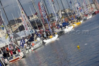 ST. MALO, FRANCE - OCTOBER 27th 2006: The Open 60 trimarans and monohull classes are watched by crowds of spectators as they prepare in St. Malo, France on October 27th and 28th for the trans-atlantic race start on Sunday October 29th 2006. The Route du Rhum is a challenging race for solo sailors which starts in St Malo and finishes in Pointe a Pitre, Guadeloupe.