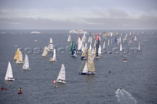 ST. MALO, FRANCE - OCTOBER 29th 2006: The Open 60 trimarans and monohull classes are watched by crowds of spectators as they start the Route du Rhum trans-atlantic race off St. Malo, France, on October 29th. The Route du Rhum is a challenging race for solo sailors which starts in St Malo and finishes in Pointe a Pitre, Guadeloupe. (Photo by Gilles Martin-Raget/Kos Picture Source via Getty Images)